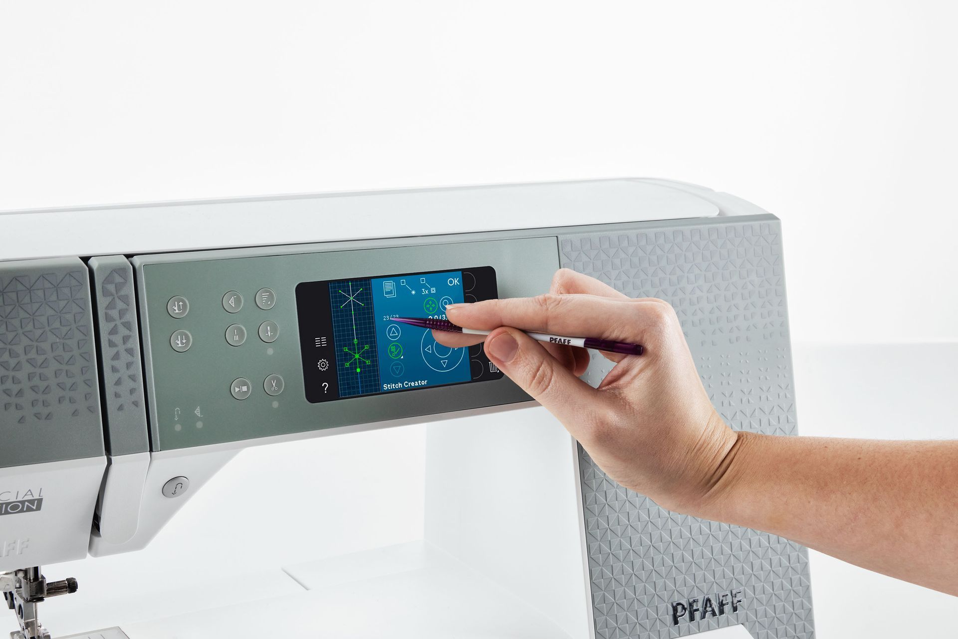 A purple and white embroidery machine made by pfaff