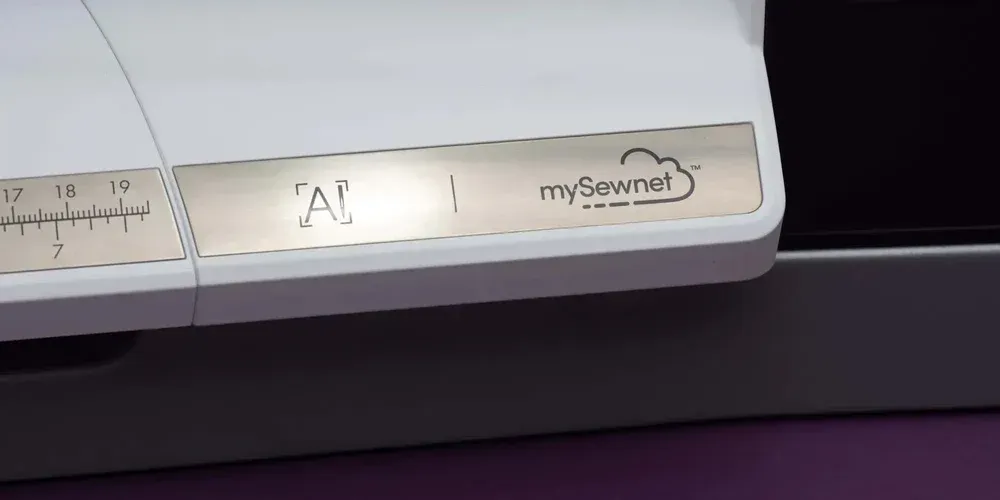 A close up of a sewing machine with a label that says ' ai ' on it