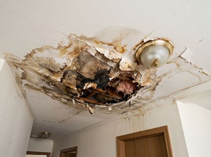 Severely water-damaged drywall ceiling undergoing repair after a leak during a drywall service in Moreno Valley, CA.