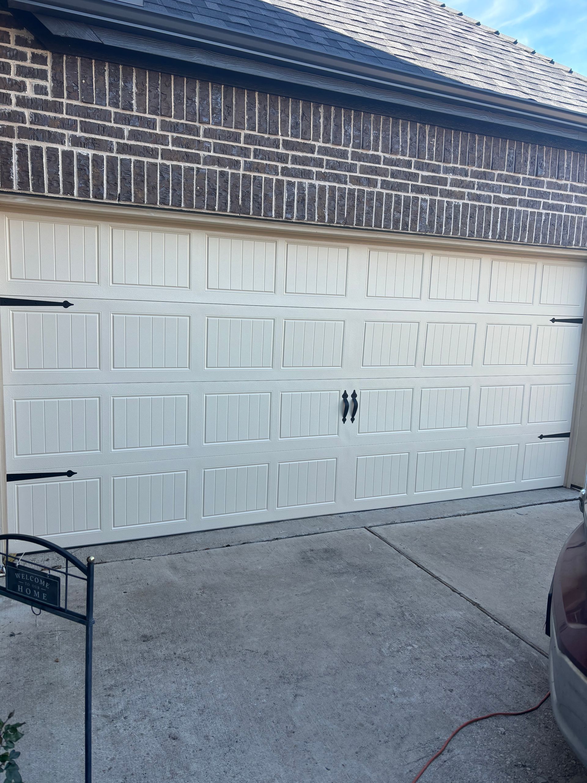 A pair of wooden garage doors on a house
