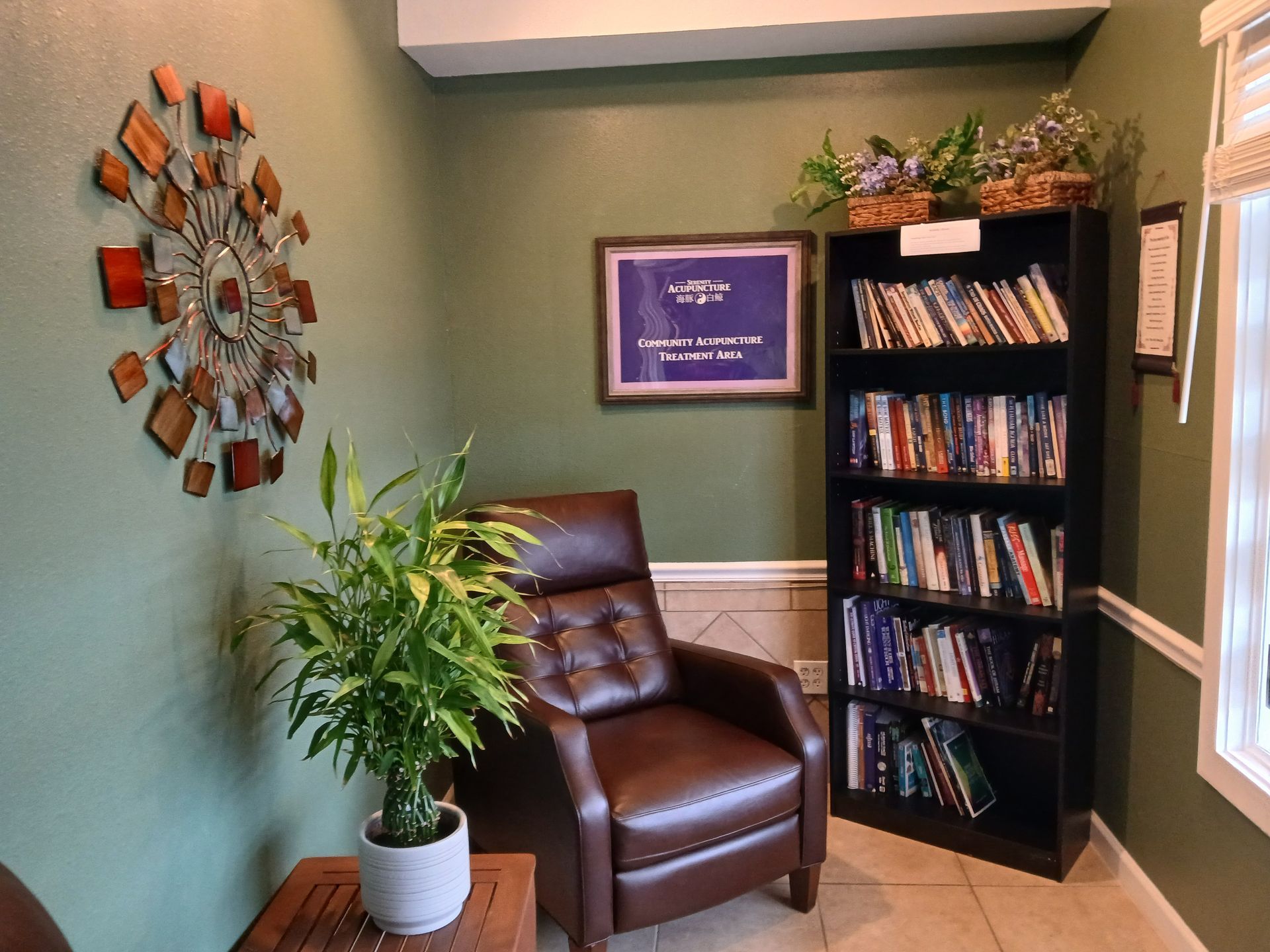 A living room with a chair and a bookshelf