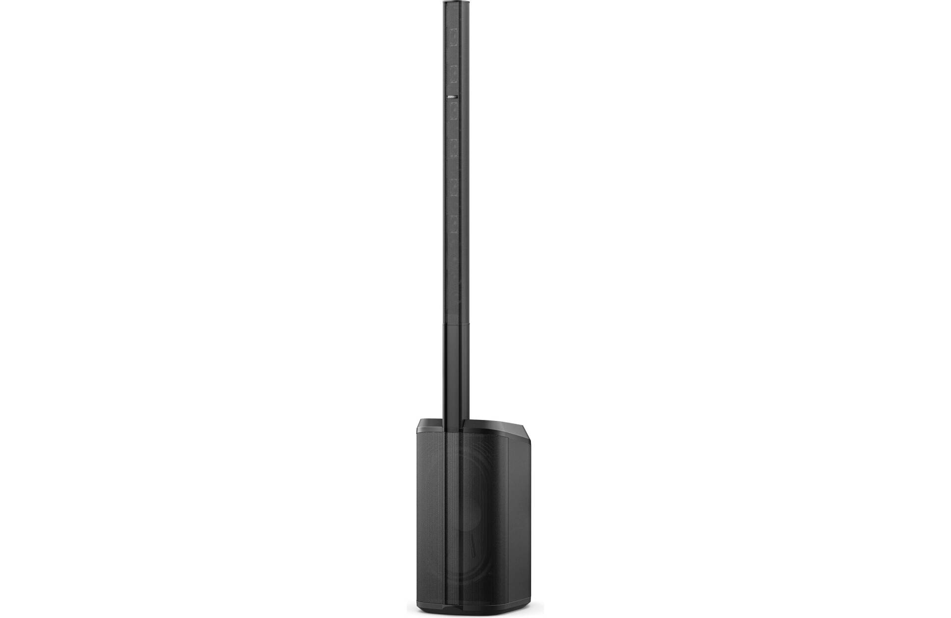 A black speaker is sitting on top of a white surface.