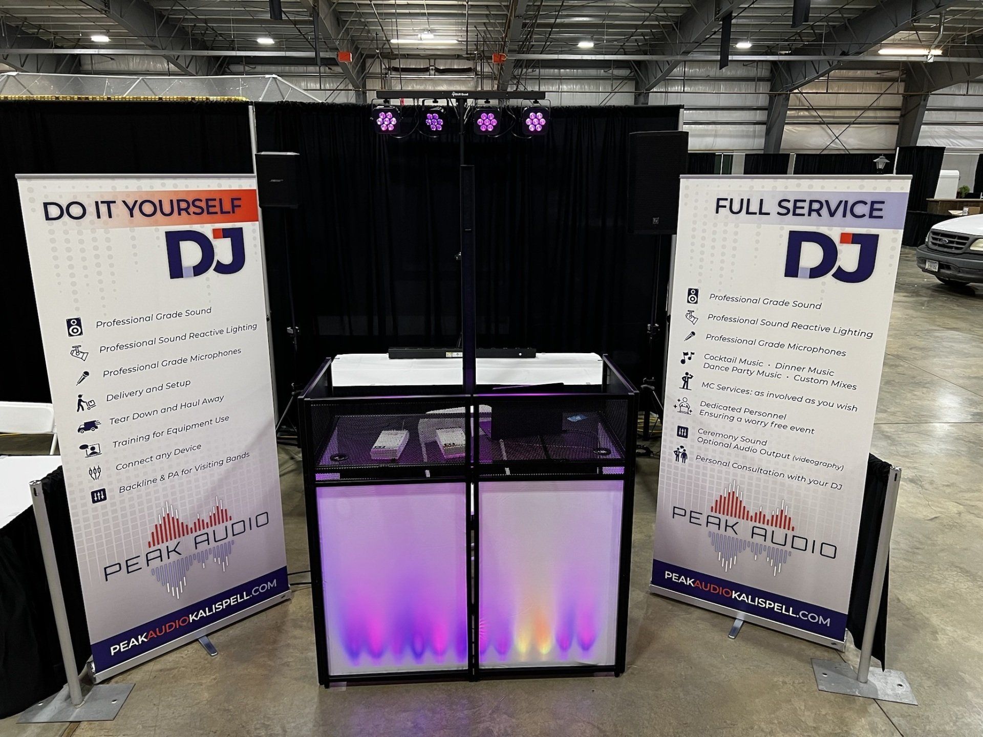 A dj booth with two signs that say dj