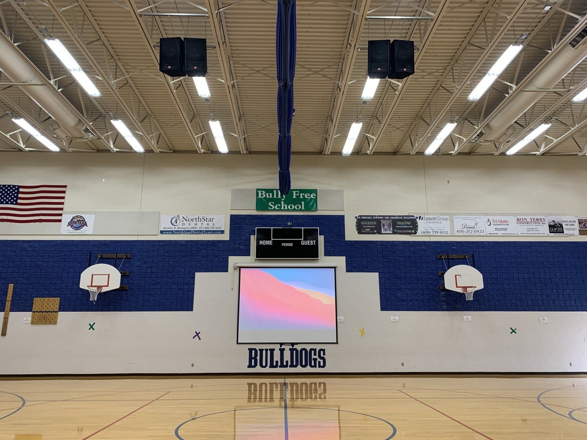 A basketball court with a sign that says bulldogs on it