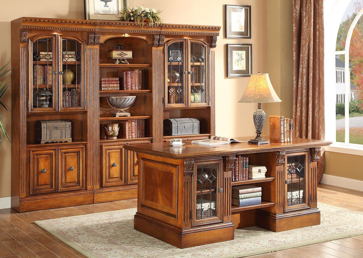 AD Construction NJ - Wooden office with bookcase and desk; books, lamp, and window visible.