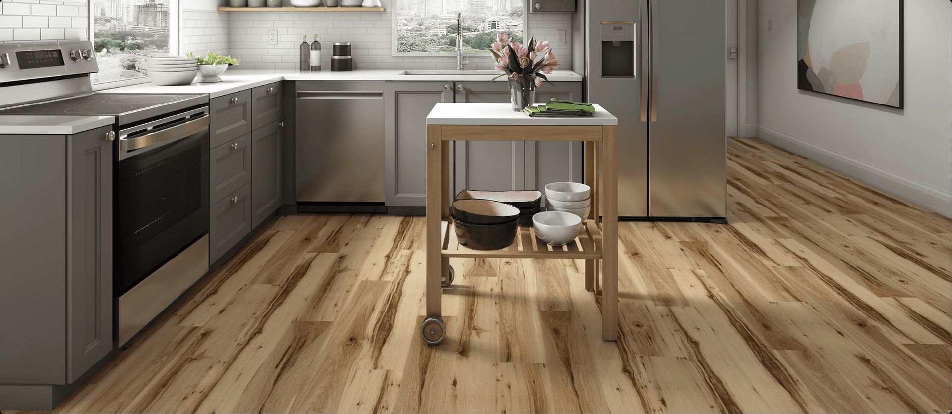 AD Construction NJ - Kitchen with wooden floors, grey cabinets, stainless steel appliances, and a mobile island.