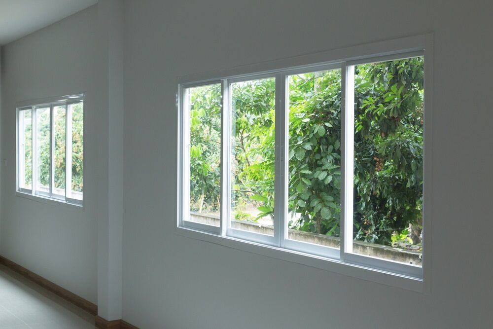A Room With A Lot Of Windows And Trees In The Background — Datco Aluminium Pty Ltd In Murwillumbah, NSW