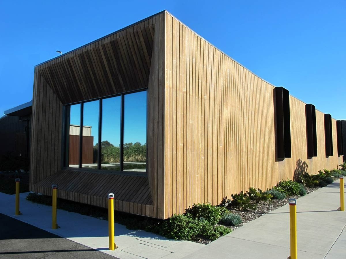 A Building With A Wooden Facade And A Lot Of Windows — Datco Aluminium Pty Ltd In Kingscliff, NSW