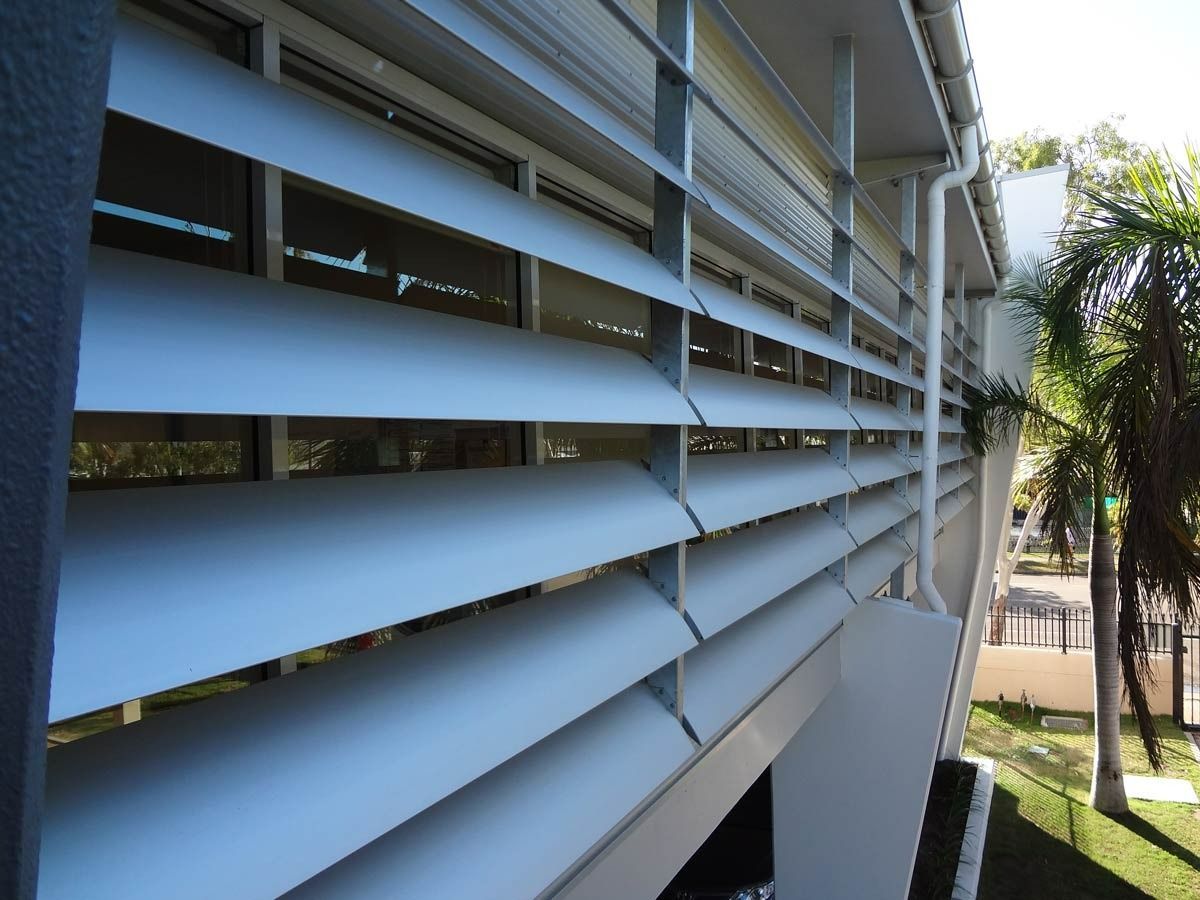 A Building With A Lot Of Shutters On It — Datco Aluminium Pty Ltd In Murwillumbah, NSW