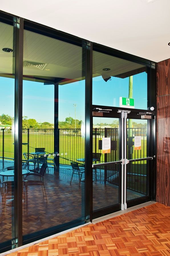 A Room With A Lot Of Windows And A Wooden Floor — Datco Aluminium Pty Ltd In Murwillumbah, NSW 
