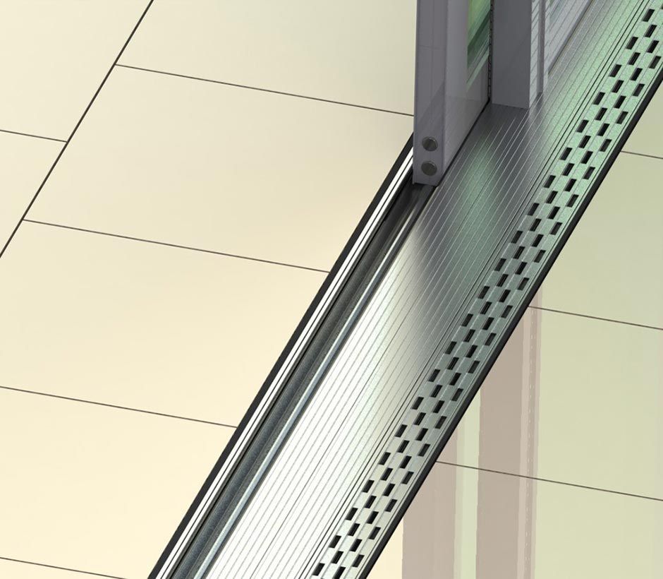 A Close Up of a Sliding Glass Door on a Tiled Floor — Datco Aluminium Pty Ltd In Murwillumbah, NSW
