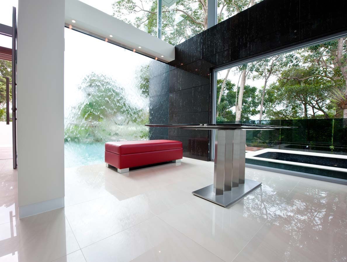 A Living Room With a Red Bench and a Table — Datco Aluminium Pty Ltd In Murwillumbah, NSW