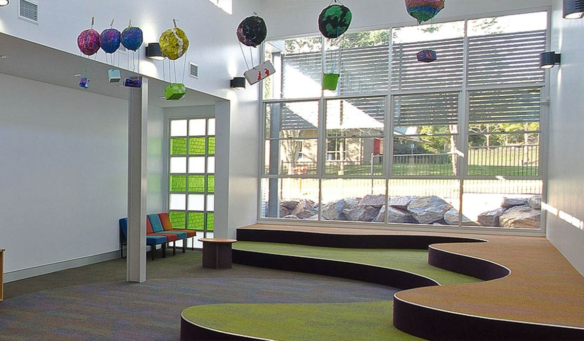 A Room With A Stage And Balloons Hanging From The Ceiling — Datco Aluminium Pty Ltd In Murwillumbah, NSW 