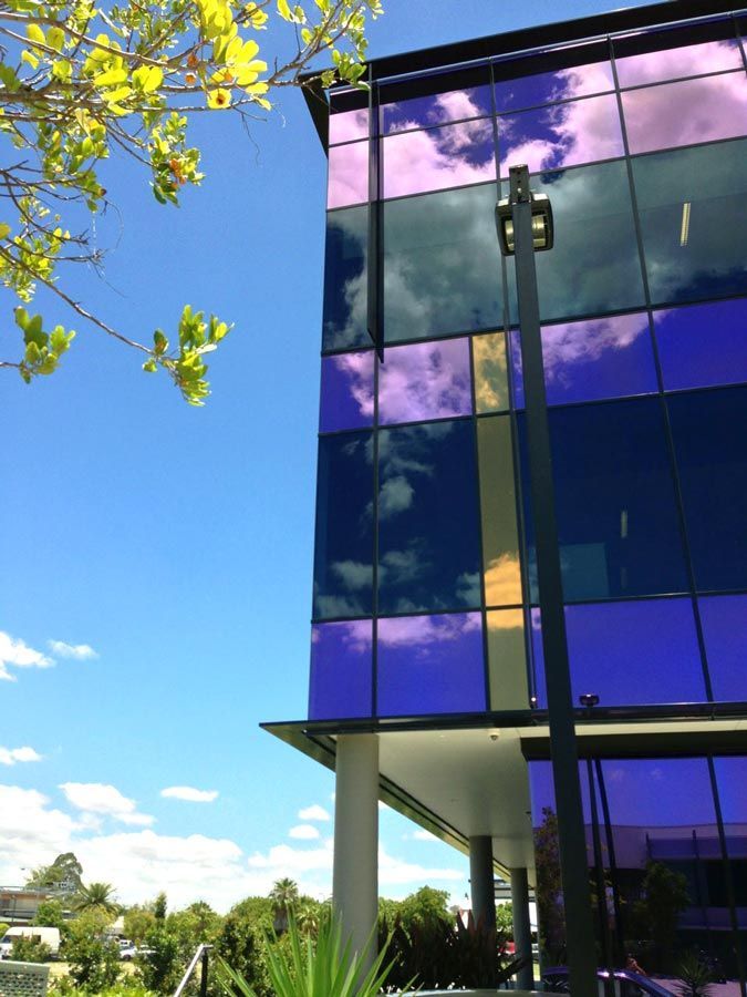 A Blue and Purple Building With a Blue Sky in the Background — Datco Aluminium Pty Ltd In Murwillumbah, NSW