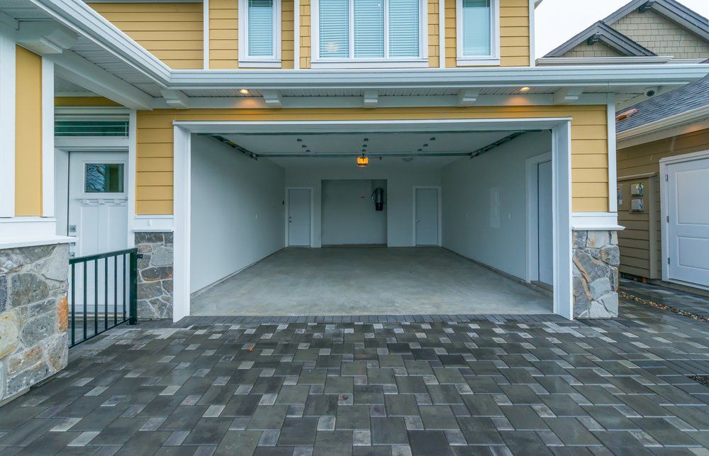 Interior Of The Empty Garage In The Residential House — Builders in Salt Ash, NSW