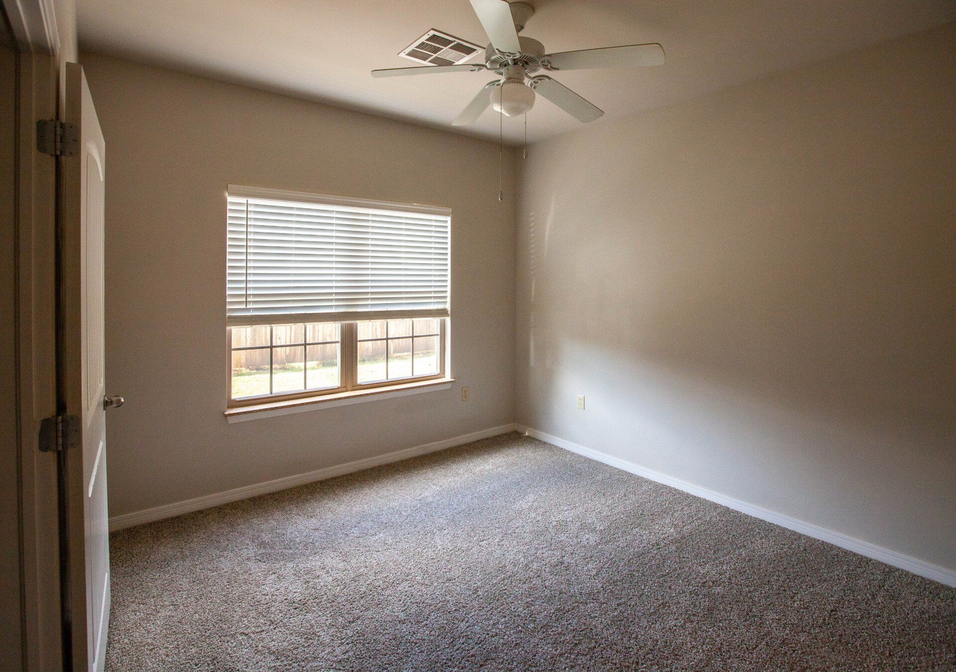 marquis on memorial bedroom with ceiling fan