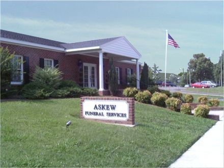 Askew Funeral Services building with an American flag.
