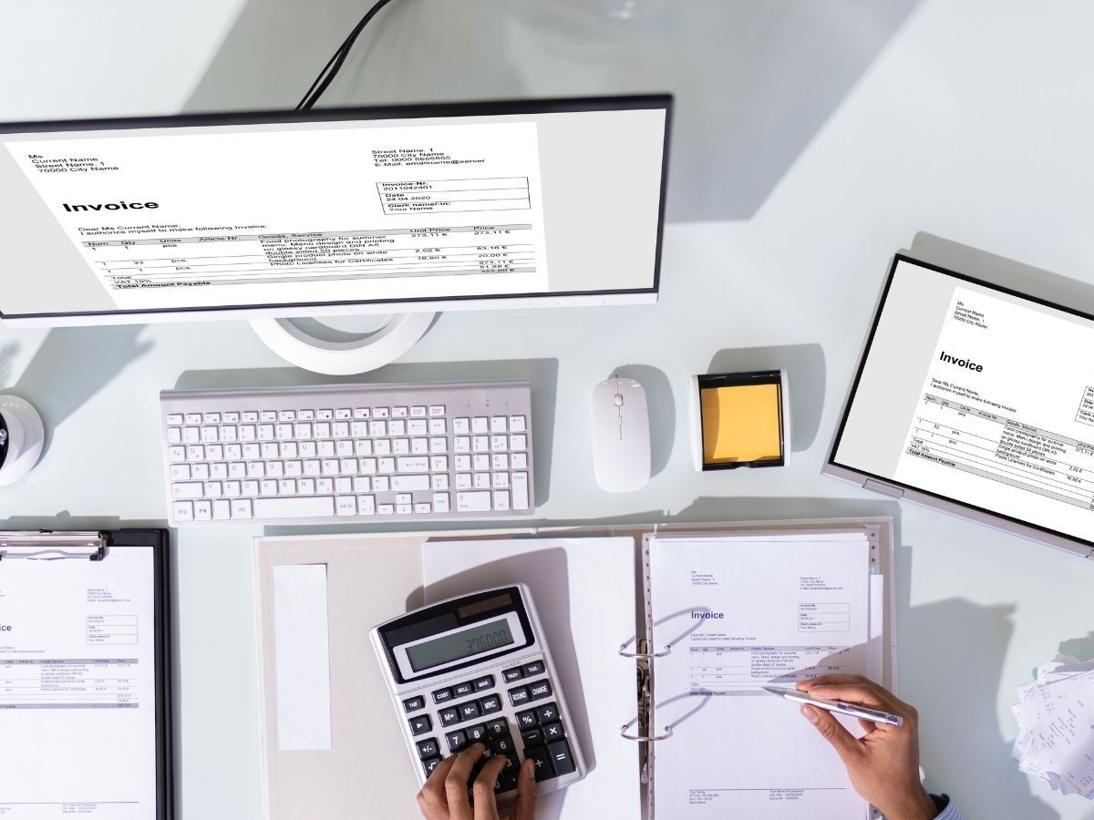 arial view of desk with invoices