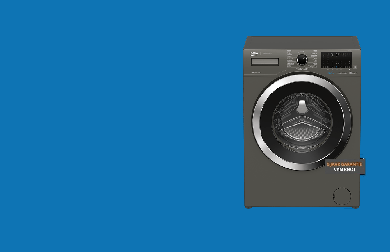 Een wasmachine staat op een blauw oppervlak.