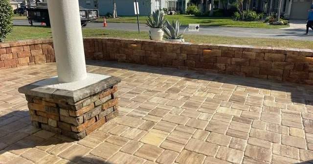 Mega Olde Towne Pavers in Sand Dune with Coordinating Stonegate Wall in Sand Dune with Undercap Lighting