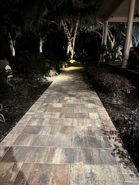 paver walkway lit up at night