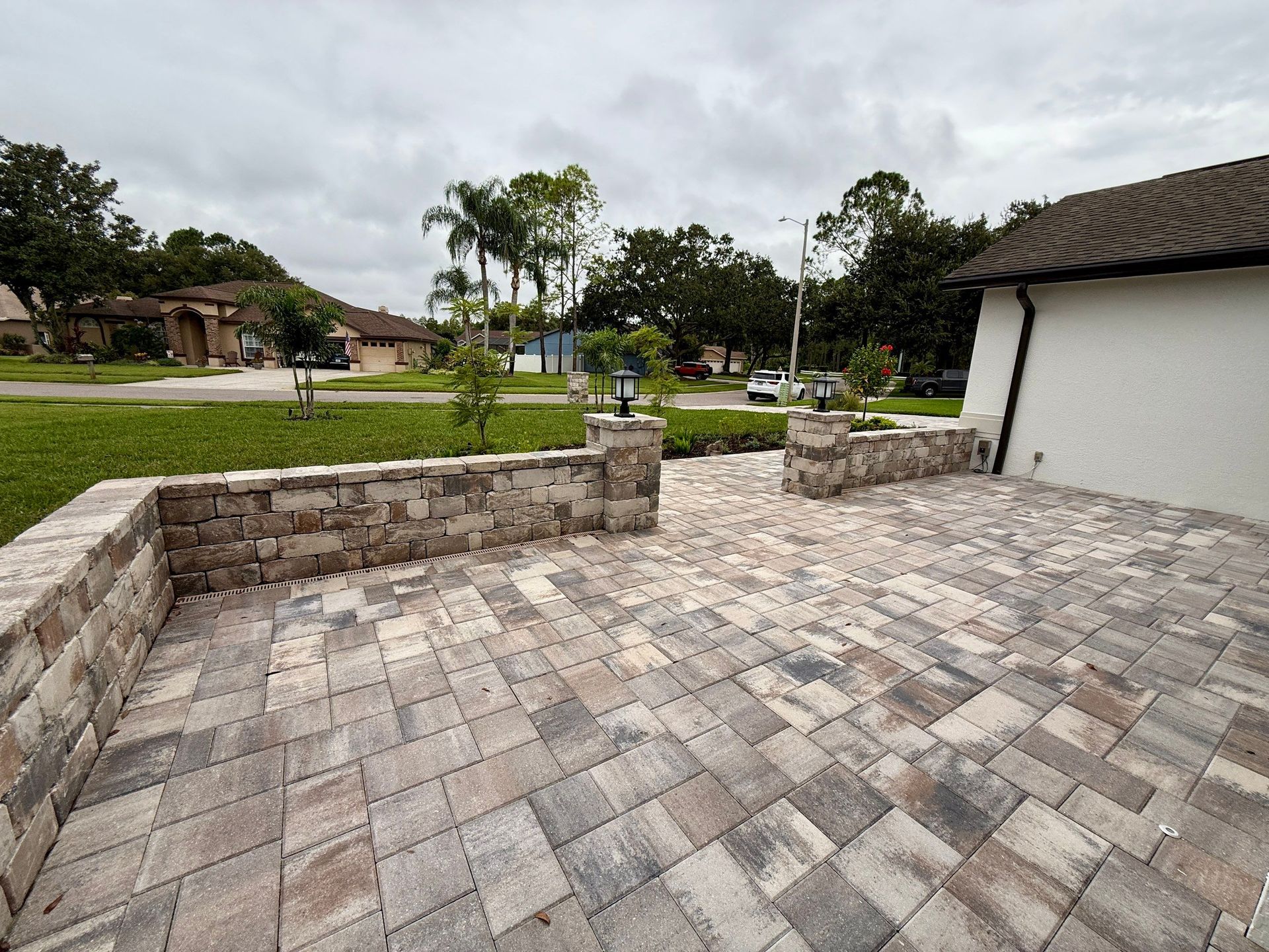 Flagstone's Victory Pavers in White/Tan/Charcoal with Matching Stonegate Wall Block