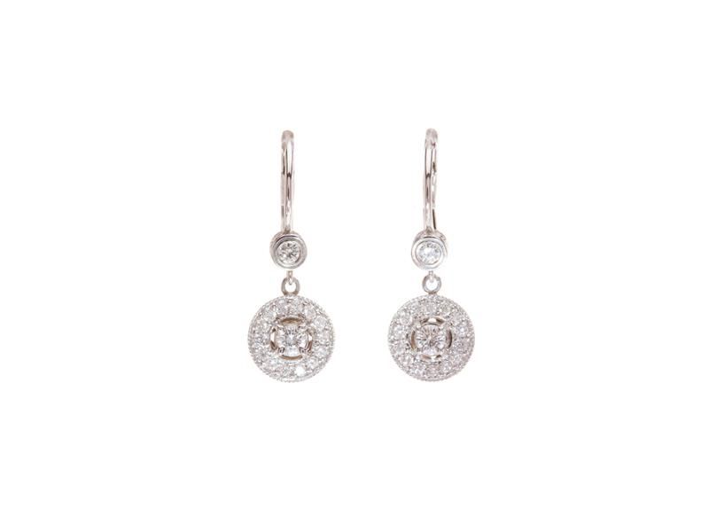 Pair of silver dangling earrings with round, sparkling pendants on a white background