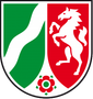 Ein grün-rotes Schild mit einem weißen Pferd auf den Hinterbeinen