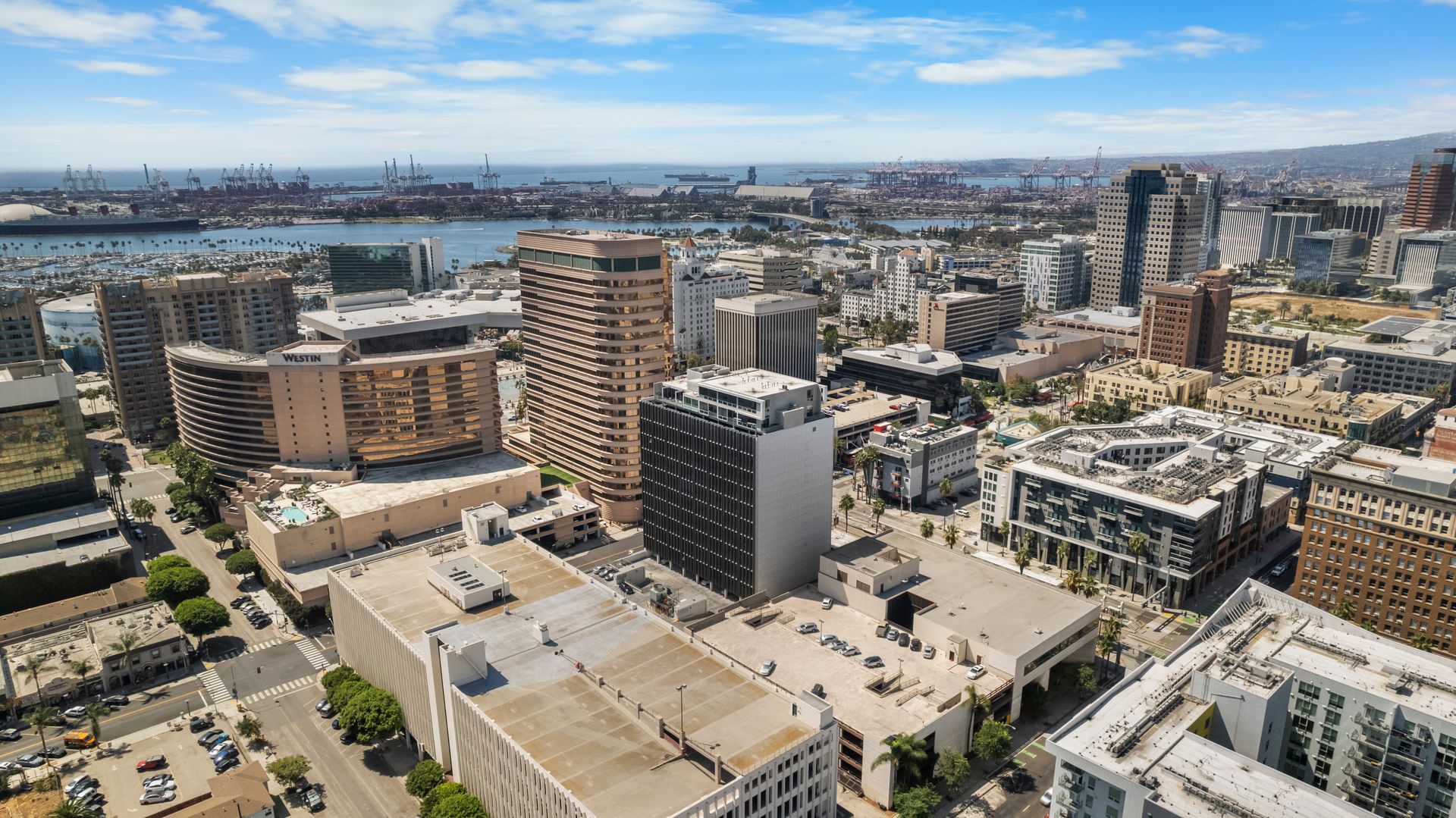 Exterior skyline of high-rise buildings with ocean in background