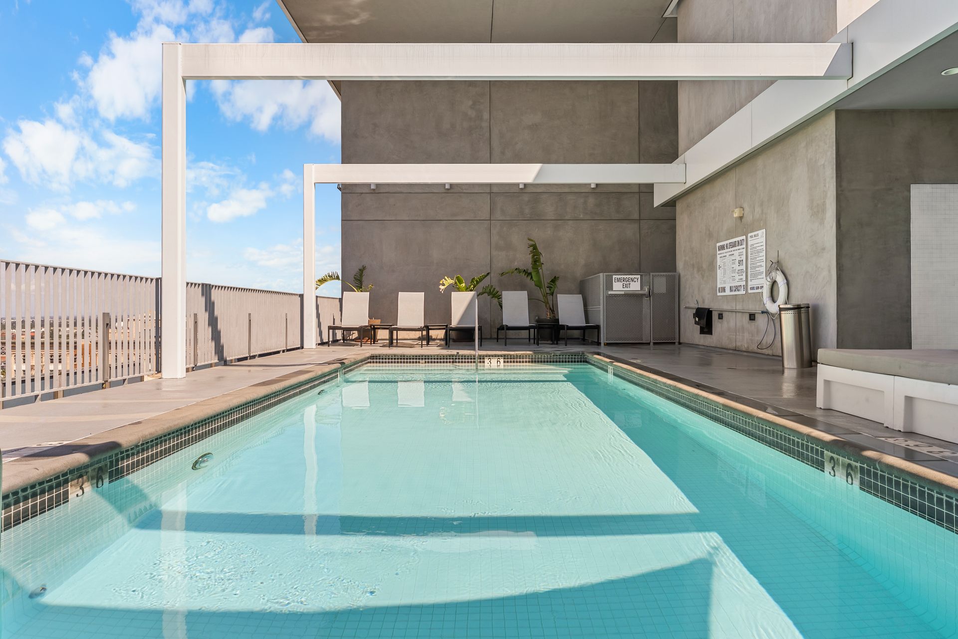 pool with lounge chairs