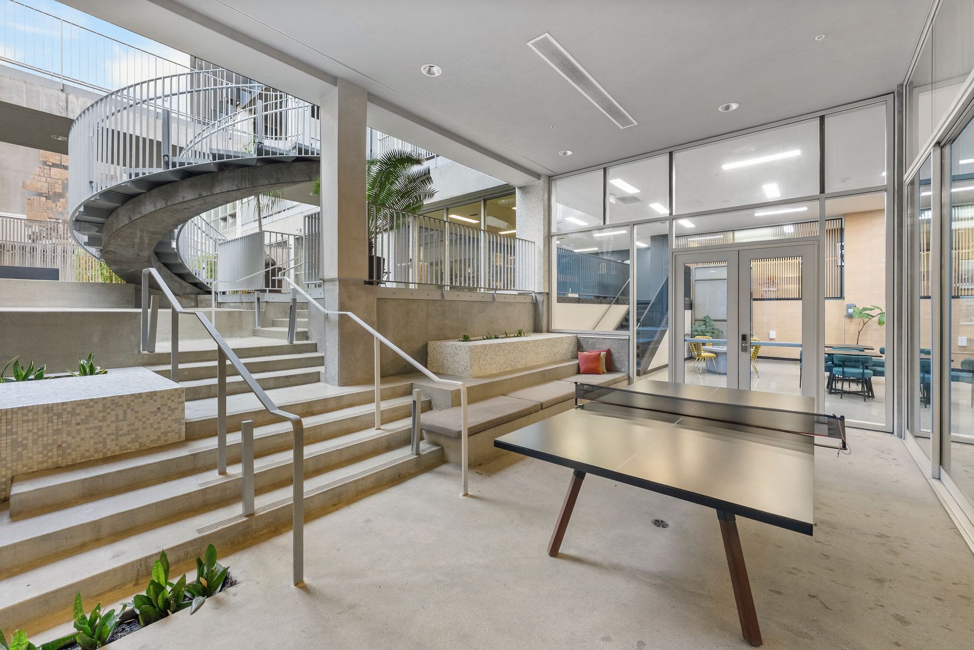 table tennis table with stairs in the background