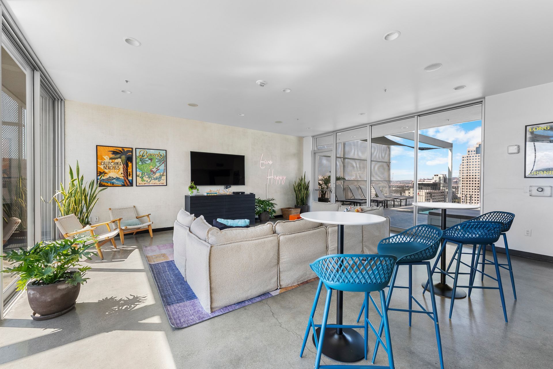 lounge room with stools, couch, and television