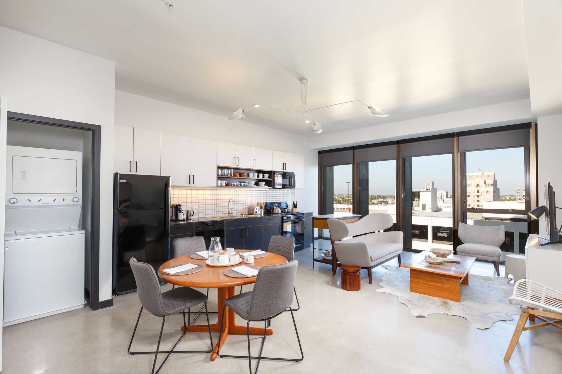 Internal Photo of Living Room with Kitchen in Background