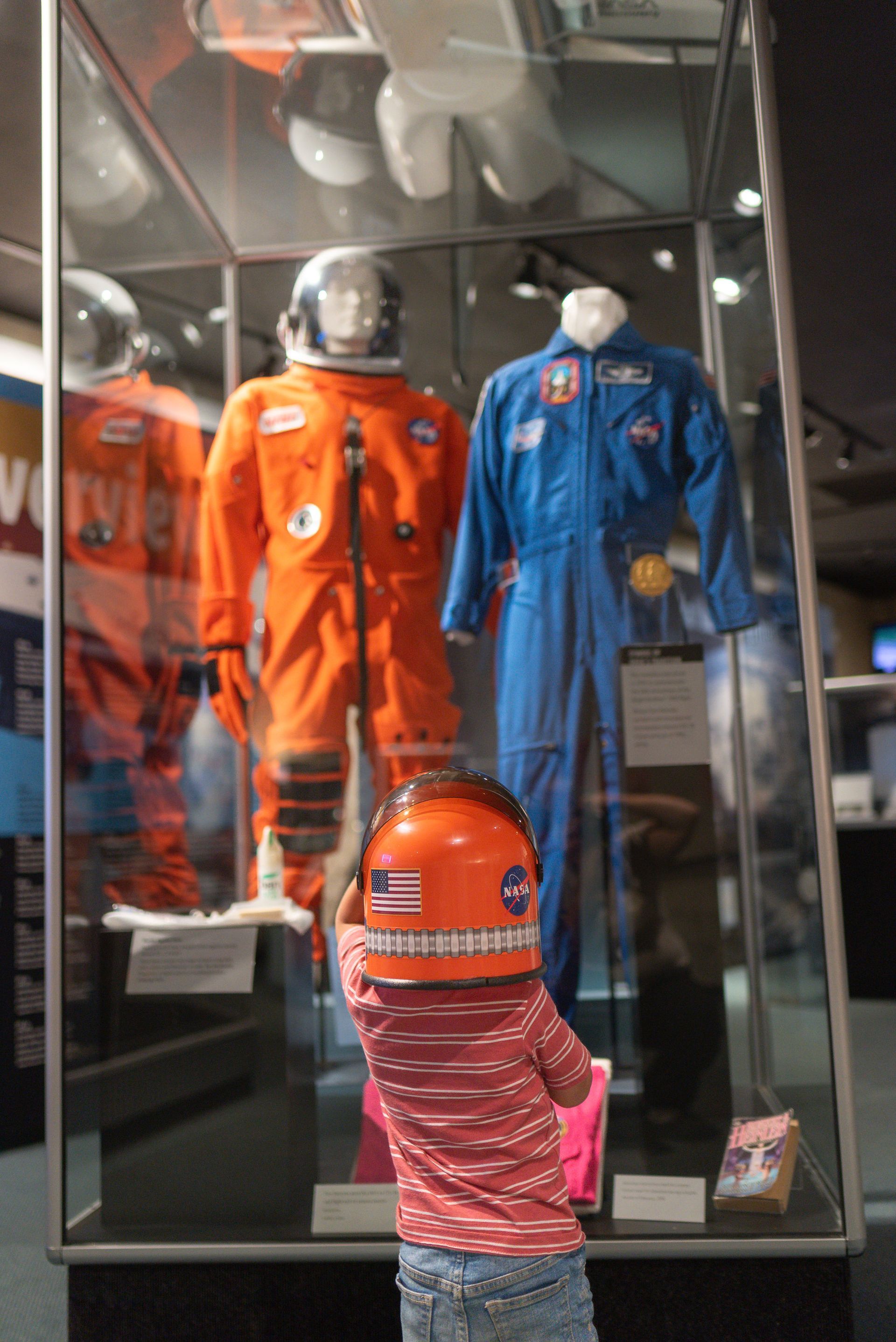 A young child looking up at artifacts in the museum's Modern Space Gallery.