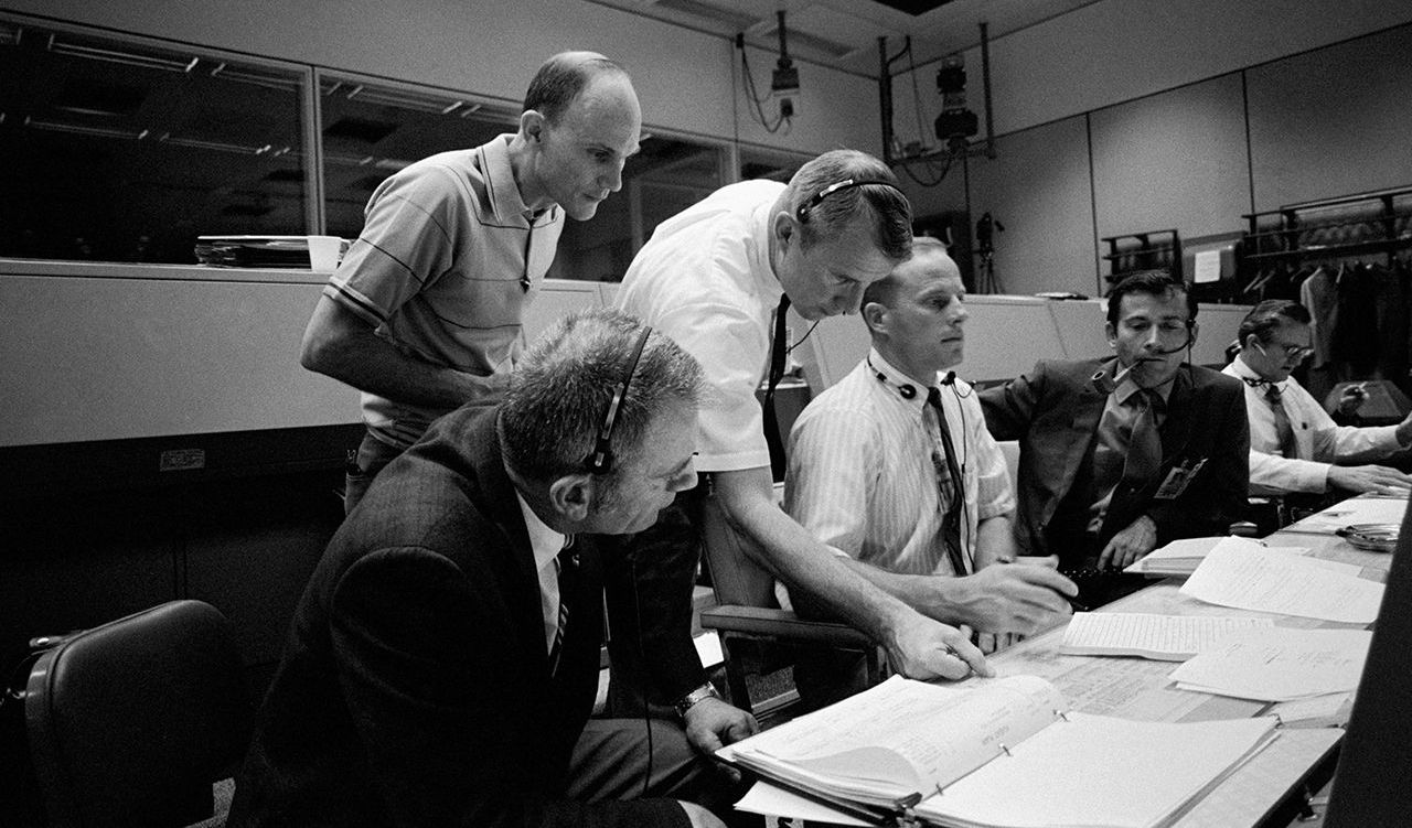 Astronaut Ken Mattingly (top left) helping Mission Control during the Apollo 13 mission. Image Courtesy of NASA.