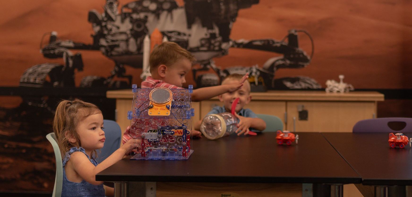 Young students experimenting with STEM related projects.