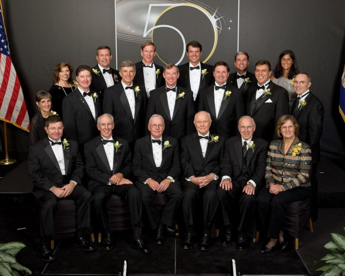 A group of Ohio Astronauts in tuxedos and formal wear pose for a photo