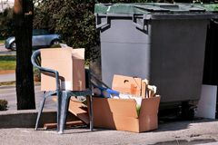 junks beside the dumpster