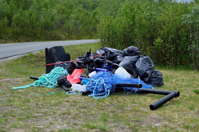 black bags and ropes beside the road
