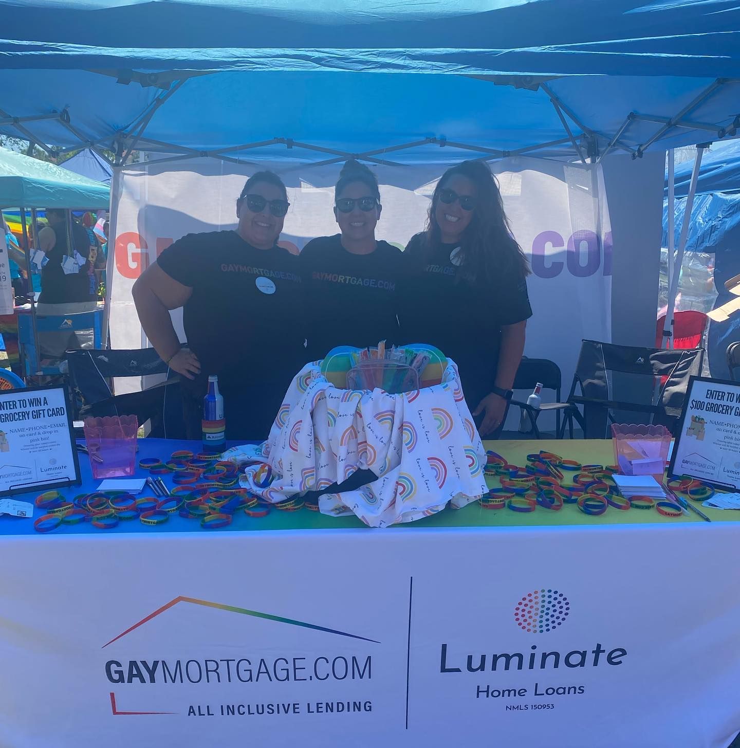 A group of people standing behind a table with a cake on it.