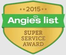 The angie 's list super service award is a gold shield with a green ribbon.