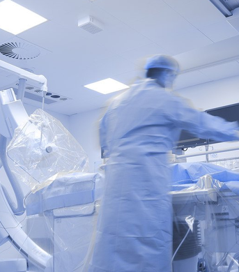 a blurry picture of a surgeon in an operating room .