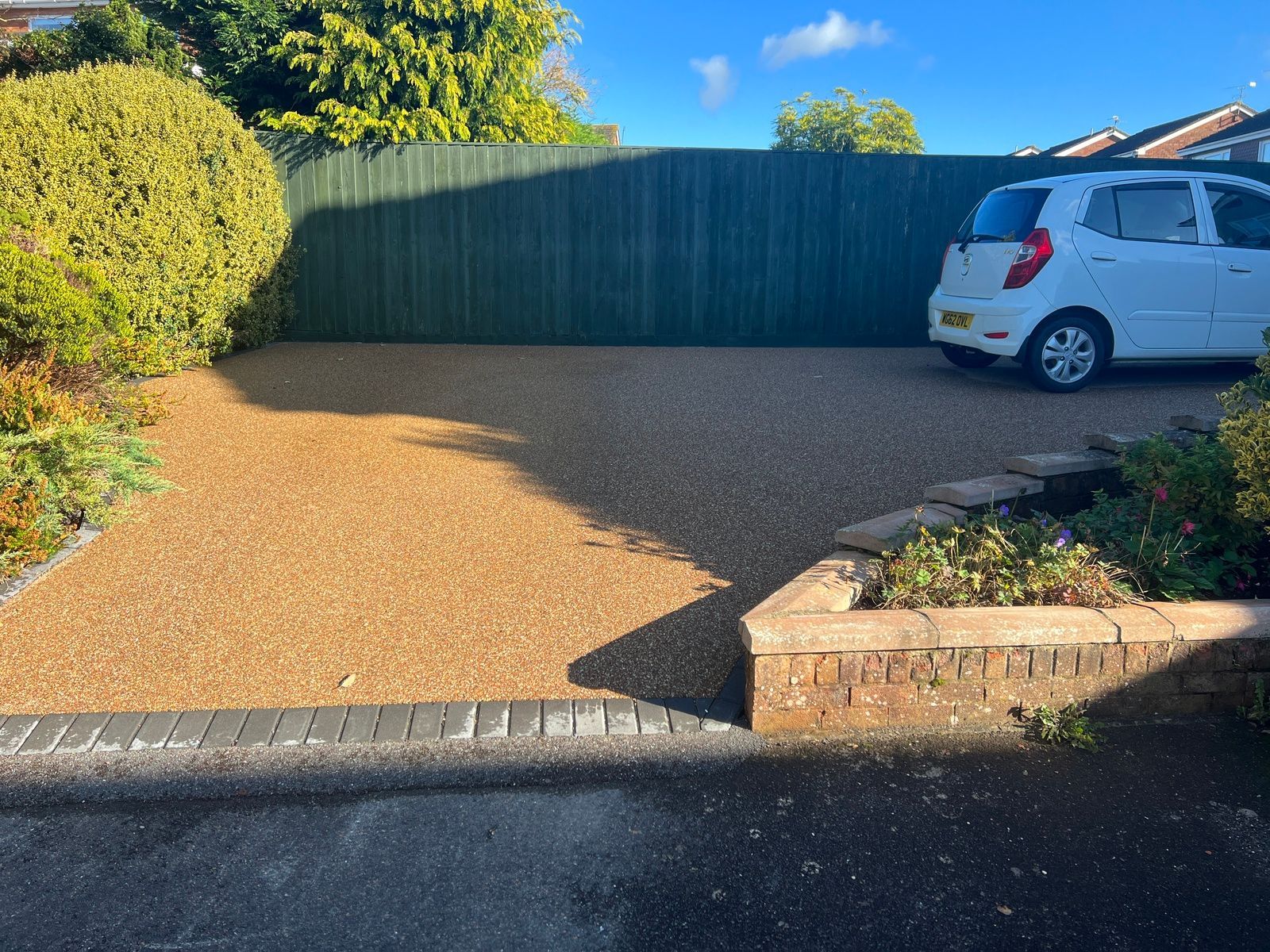 Gold-coloured resin driveway.