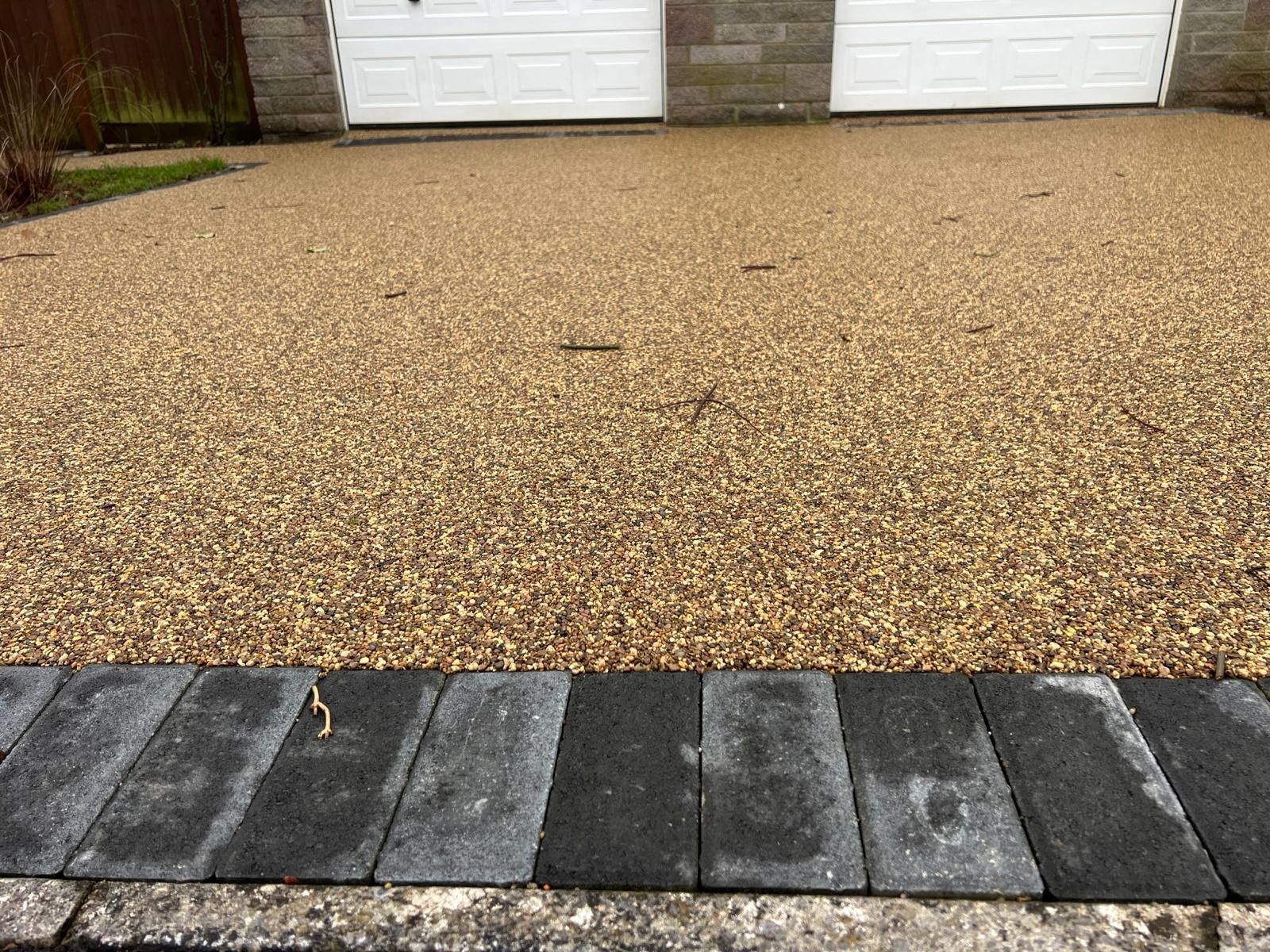 A close up of a gray asphalt road.