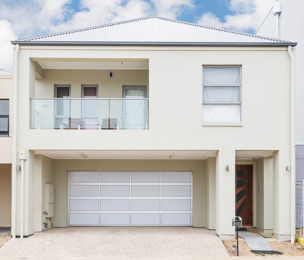 Two-story Modern House With a Garage and Balcony — Country Coast Valuers in Cundletown, NSW