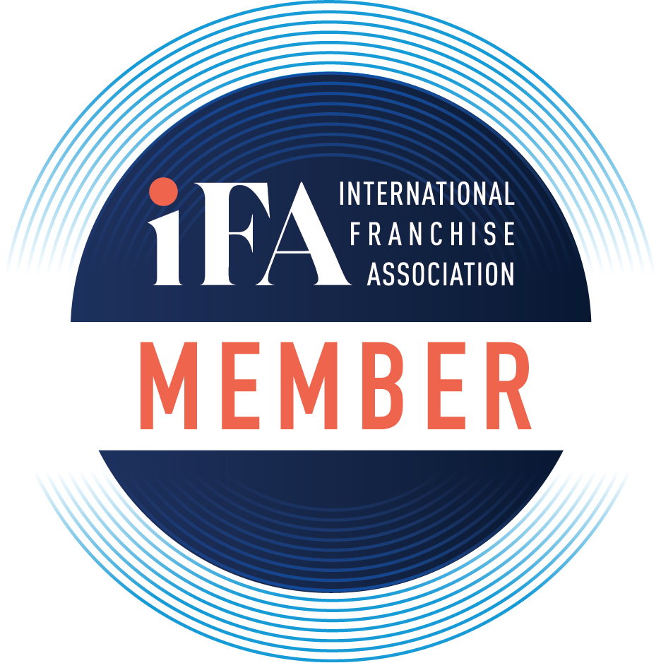 IFA International Franchise Association member logo with blue and orange circular design