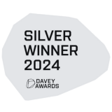 Silver Winner 2024 Davey Awards logo on a light gray irregular shape background.