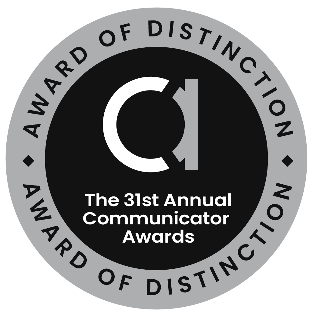 Award of Distinction seal: black circle with white 