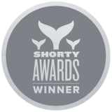 Gray Shorty Awards winner badge with three whale tail icons.