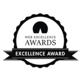 Web Excellence Awards badge. A black, circular emblem, with 